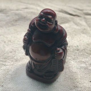 Molded Red Resin Figure Of Buddha,  Standing And Laughing With Gifts