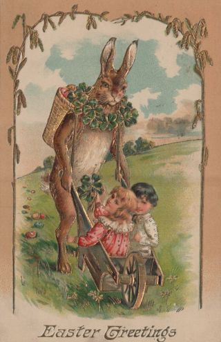 Postcard Easter Greetings Boy And Girl In Wheel Barrel Pushed By Giant Rabbit