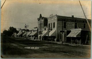 1907 Strong City Kansas Rppc Photo Postcard Main Street " One Minute Hotel " View