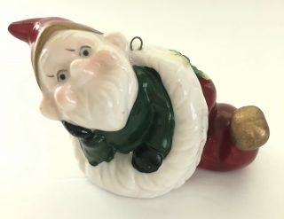 Vintage Gnome Elf Pixie Green Suit Crawling Out Santa’s Red Hat Ceramic Figurine