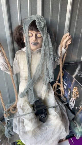 Spirit Halloween Zombie Swing Girl