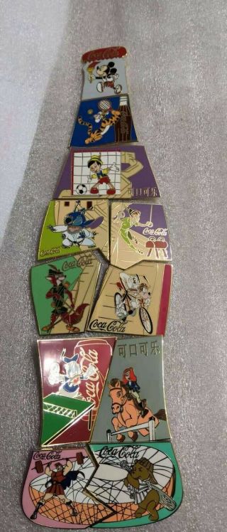 Fantasy Pins Coke Puzzle 11 Pins Disney Mickey,  Winnie,  Goofy,  Olympic Sport