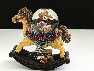 Is It Too Early For Christmas? A Rocking Horse With Snow Globe & Gifts