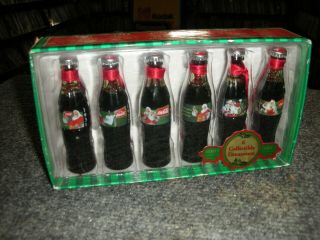 Evolution Of The Coca Cola Santa Series One Bottle 6 Mini Bottles