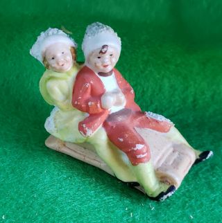 Snow Baby Figure,  Boy And Girl On Sled,  Snow Babies 2
