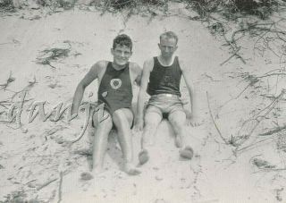 Swimsuit Young Man Sitting On A Sandy Hill With Their Feet In Camera Old Photo