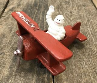 Michelin Man Bibendum Vintage Cast Iron Red Model Biplane Airplane Figurine