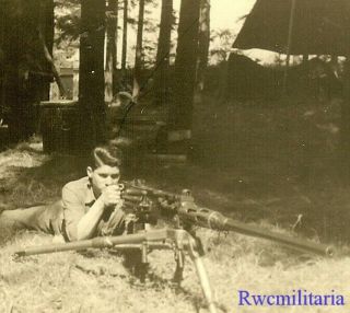 At Ready Us Soldier Aiming M2 Browning Heavy Machine Gun In Woods