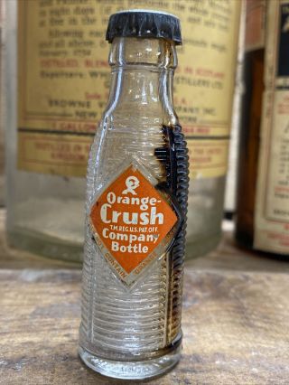 Vintage Orange Crush 3 1/2 " Miniature Soda Bottle With Cap.  Ribbed Glass Bills