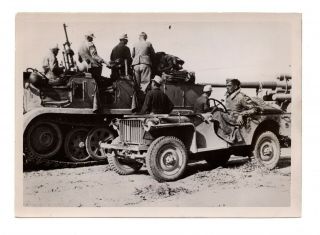 WWII German Press Photo German Afrikakorps Soldier In Captured Jeep Near Sdkfz 7 2