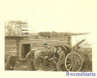 At Ready Gebirgsjäger Troops W/ 7.  5cm Artillery Gun By House; Russia