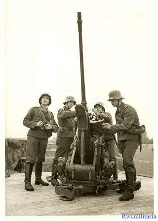Press Photo: At Ready Helmeted Luftwaffe Troops Manning 2cm Flak Gun; 1939