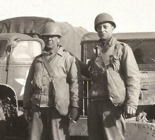 WW2 photo - 2 US Soldiers Standing by Trucks & Weapons Carrier 2