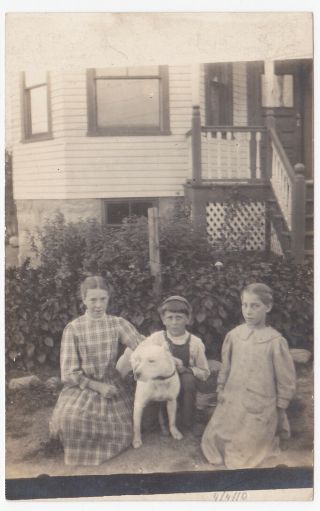 Old Azo Rppc Photo Postcard Of Children With A Dog In Front Of A House