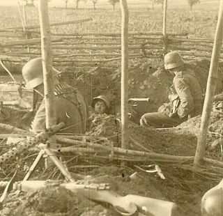 Tough Looking Wehrmacht Combat Infantry Truppe Hunkered Down In Field; Russia