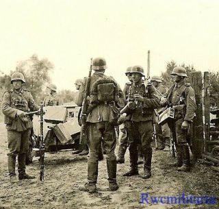 Tough Veteran Looking Helmeted Wehrmacht Combat Truppe In Russian Village