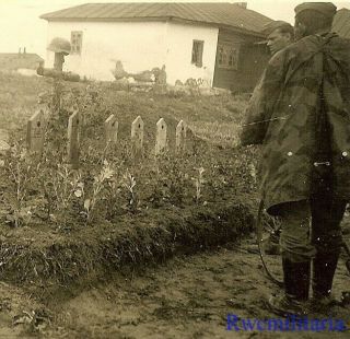 Somber Wehrmacht Troops In Camo Ponchos View Kia Comrade Graves; Russia 1941