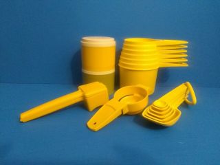 Set Of Yellow Vintage Tupperware Measuring Cups And Spoons