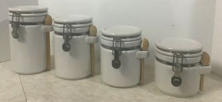 Alco White Canister Set Of Four With Wooden Spoons And Lids