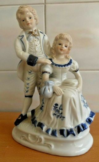 Porcelain Blue And White Lady & Man In 18th Century Dress.  22cms