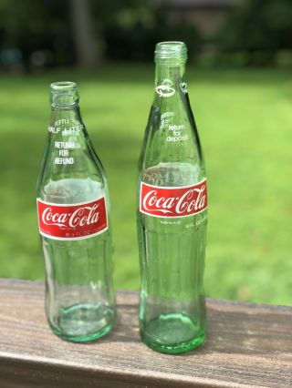 Coca - Cola Coke Bottles Two.  Both Have The Red Decal On Green Glass.  Dallas Tx