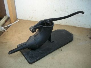 Old Cast Iron Sausage Stuffer Mounted On Board