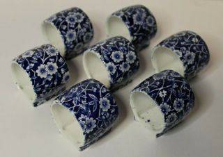 Set Of 7 Footed Porcelain Napkin Rings Blue & White Flowers Vntg Made In England
