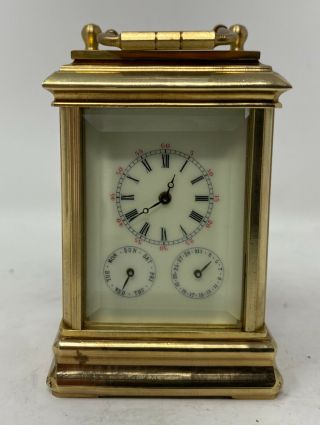 A Multi Dialled Miniature Brass And Bevelled Glass Carriage Clock