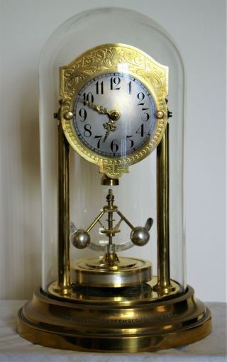Junghans 400 Day Anniversary Clock With Glass Dome And Governor Type Pendulum.