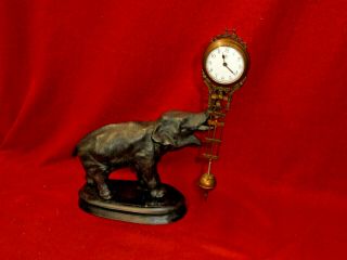 Unusual Elephant Mystery Swinger Clock - Clock Swings Back & Forth On The Statue