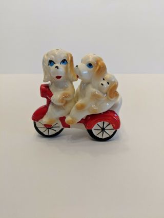 Vintage Salt And Pepper Shakers Dogs Puppies Riding A Bike Bicycle Scooter