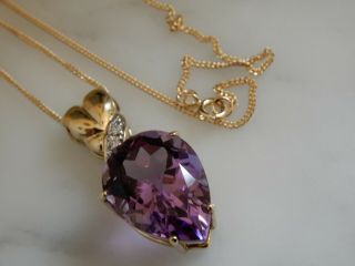 An 9 Ct Gold Large And Heavy Amethyst And Diamond Pendant And Chain