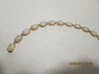 Opal Bracelet In 14 Kt Yellow Gold With 17 Oval - Cut Opals.