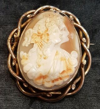 A Large Antique Carved Double Figure Shell Cameo Pin Brooch.  Gold Pinchbeck?