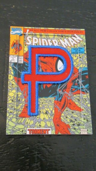 2014 Upper Deck Marvel Premier Spider Man Code Name Plate Relic