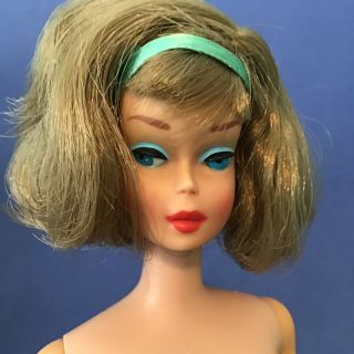 Vintage Ash Side Part American Girl.  Long Hair And Tons Of Blush