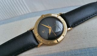 Vintage Swiss Cyma mechanical men ' s watch,  18k solid gold,  black dial,  runs 3