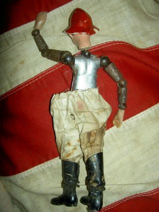 Antique,  Bucherer SABA multi - jointed FIREMAN doll molded fire helmet,  undressed 3
