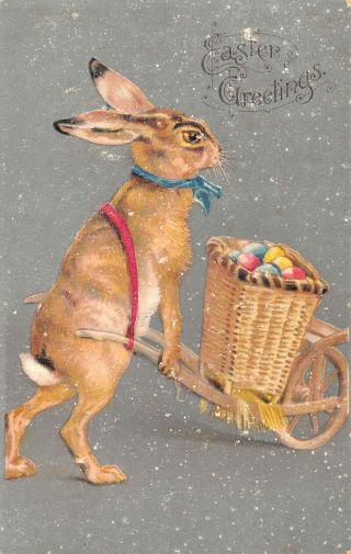 Easter Greetings Rabbit With Egg Wheelbarrow Vintage Postcard Aa17457