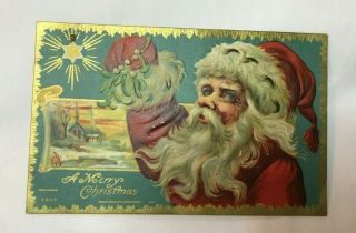 Vintage Embossed Christmas Postcard Santa Claus Holding Mistletoe