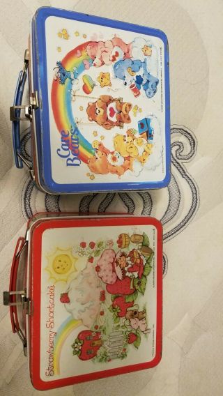 Care Bears And Strawberry Shortcake Vintage Lunch Boxes.