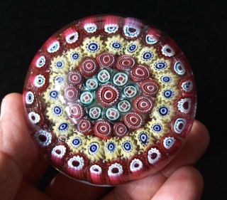 A Vintage Murano Glass Paperweight With Red And Yellow Millefiori