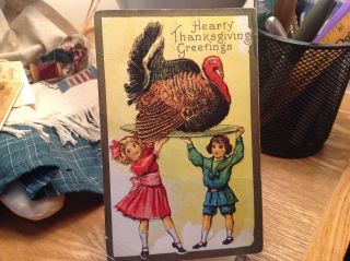 Vintage Thanksgiving Postcard Boy And Girl Holding Up Turkey On Plate