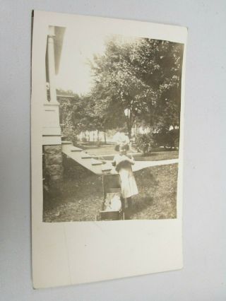 J407 Postcard Rppc Vintage Little Girl Playing With Her Doll Toy In Backyard