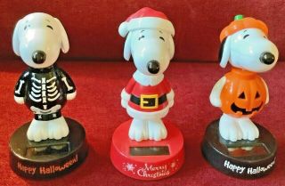 Set Of 3 Fun Holiday Peanuts Snoopy Solar Bobble Heads: Halloween/christmas
