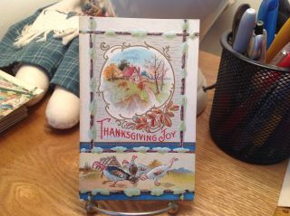 Vintage Thanksgiving Postcard Turkeys Under House,  White Wood Background