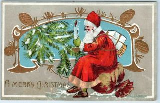 Vintage Christmas Postcard Santa Claus In Red Suit Sitting On Bag Of Toys E.  B.  C.