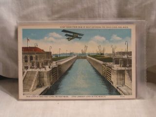 Vintage Post Card For The Davis Lock Soo.  Mi With A Biplane Overhead