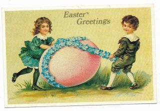 Vintage Greetings Postcard Easter Greetings Boy Girl Egg Flowers Lillian Vernon