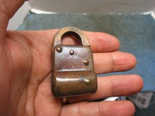 Very unusual old brass CORBIN padlock lock w/key.  Keyhole on side of body.  n/r 2